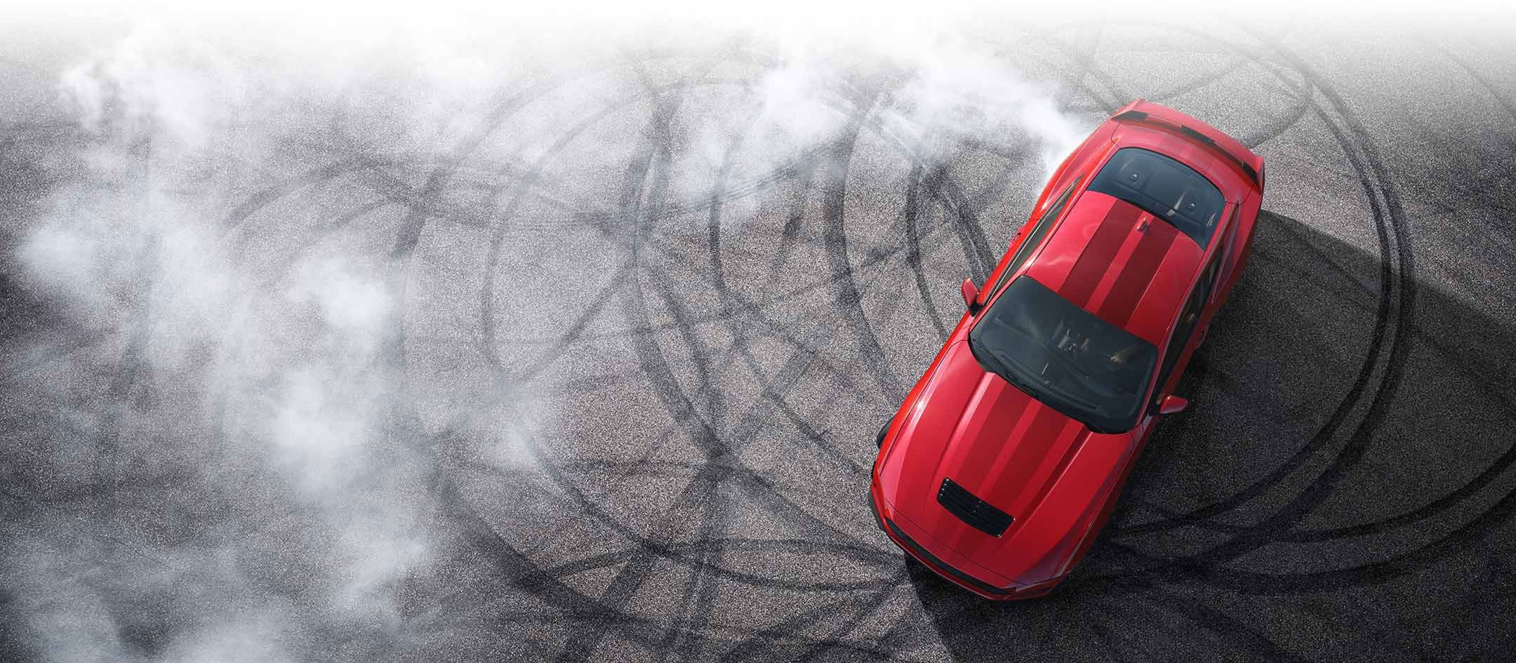 Overhead view of a 2024 Ford Mustang® model with tire tracks on pavement | Pruitt Ford in Burkburnett TX